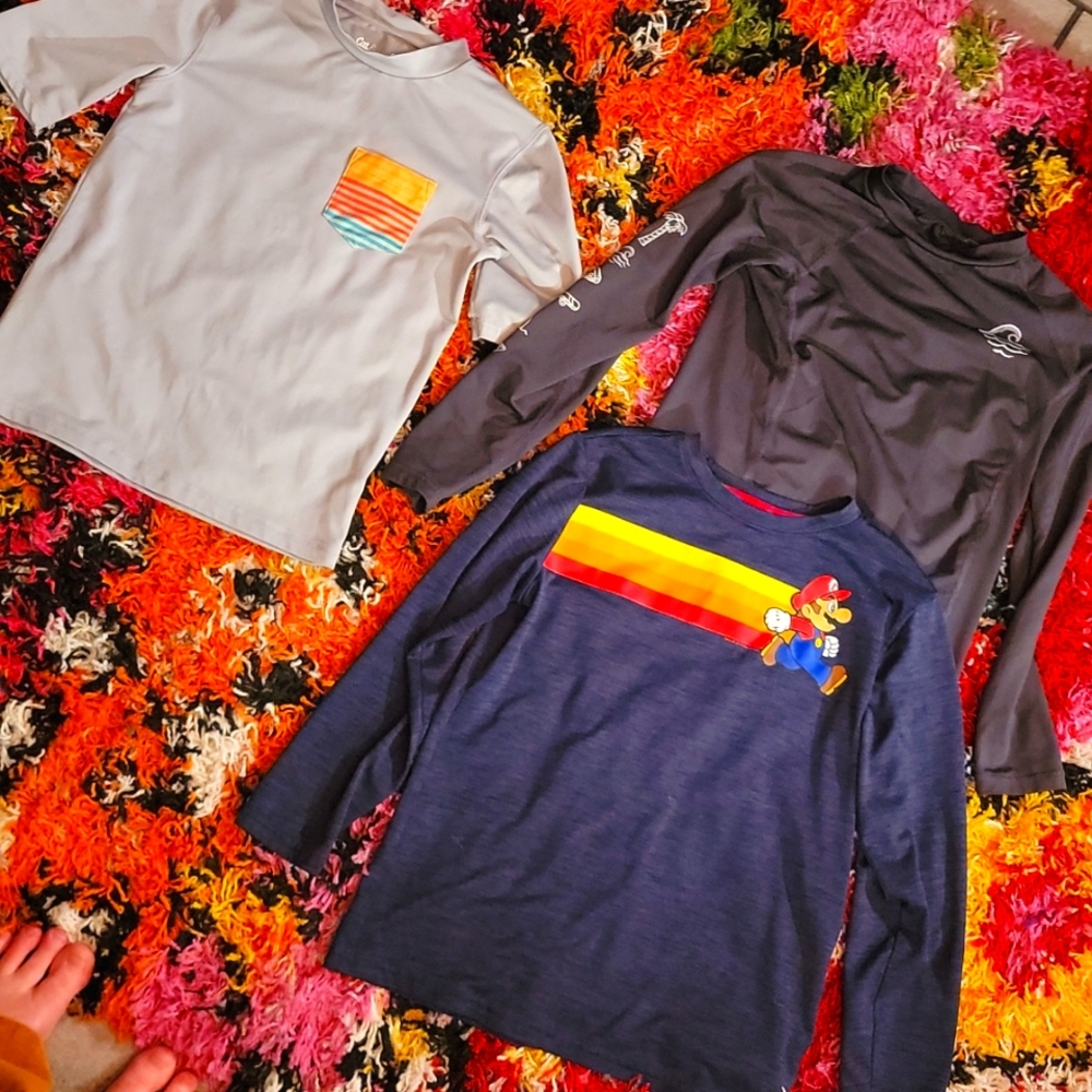Size 8/10 med swim shirts. 3 for 30$